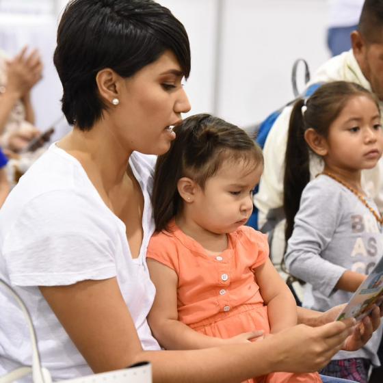 Hispanic parents reading to children